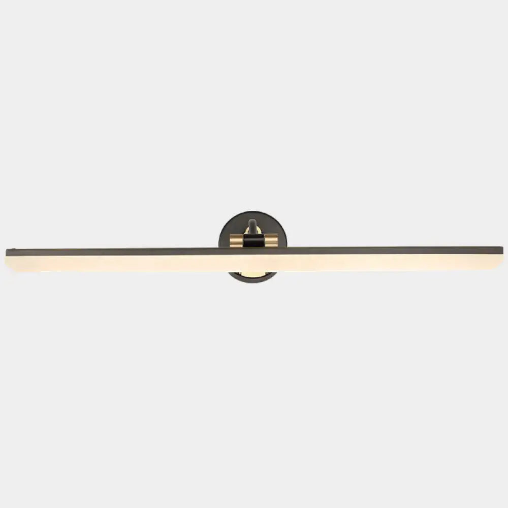 Minimalist black and brass wall mounted vanity light with matte black rectangular design and warm ambient glow