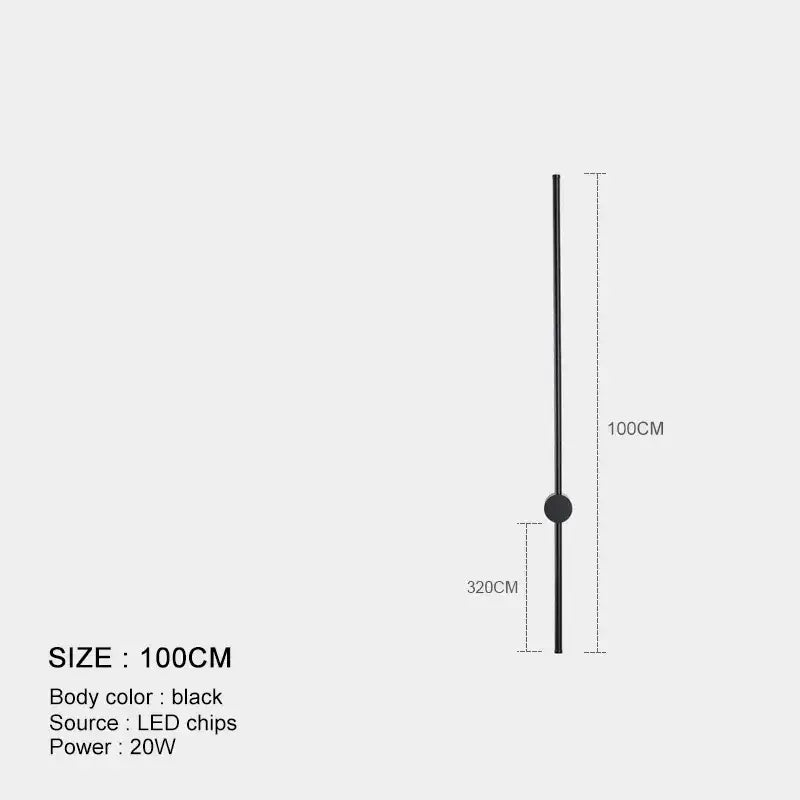 Minimalist black and brushed brass led wall lamp with a sleek cylindrical body and circular accent for living room use