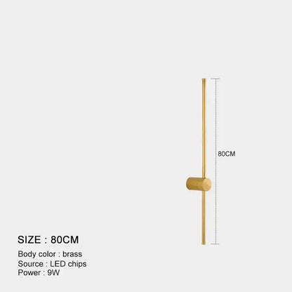 Minimalist black and brushed brass led wall lamp with vertical rod and cylindrical accent for living room lighting