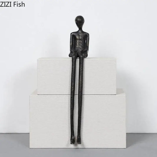 Minimalist black character metal statue with elongated limbs and smooth head as a metal statue desk ornament