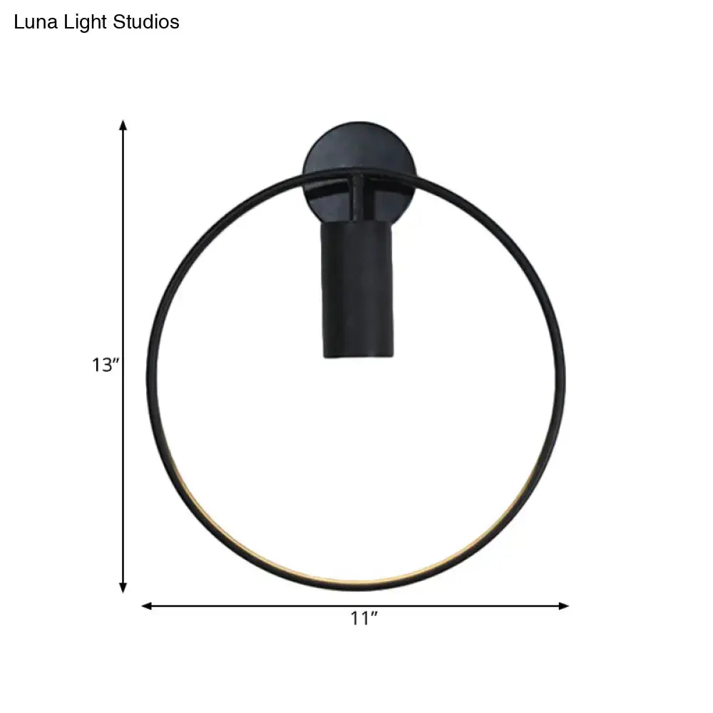 Minimalist black circular metal sconce wall-mounted light fixture with sleek modern design and 13-inch height