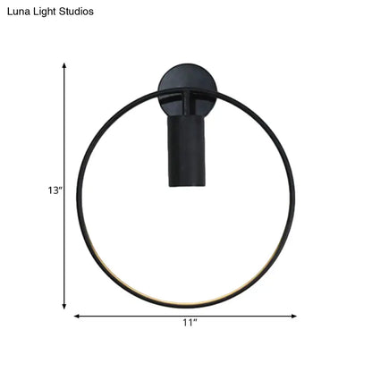 Minimalist black circular metal sconce wall-mounted light fixture with sleek modern design and 13-inch height