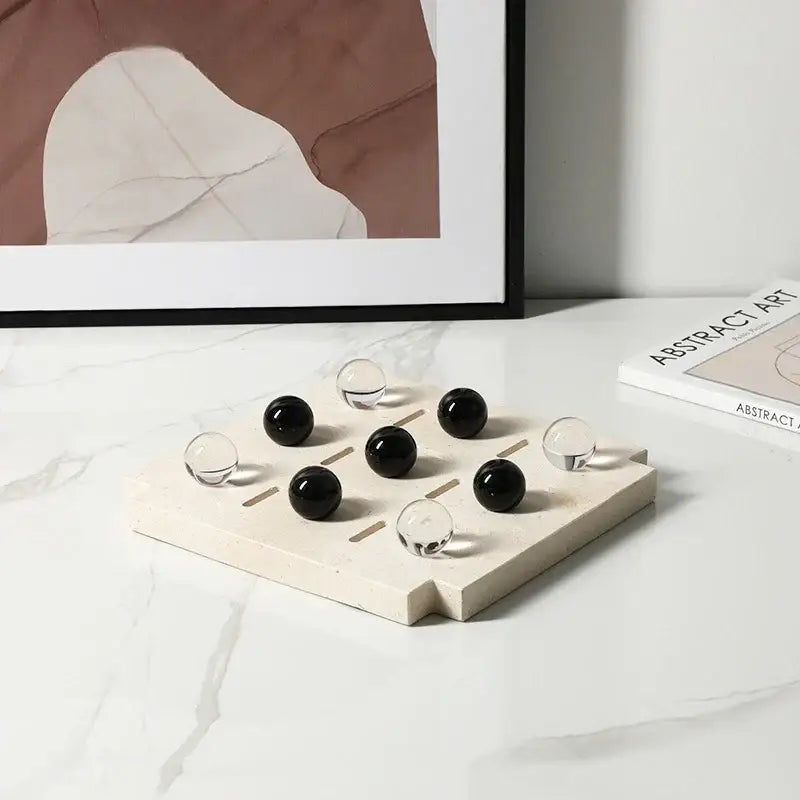 Minimalist black and clear geometric glass bead chess set with recessed marble slots for modern decorbites geometric glass decor