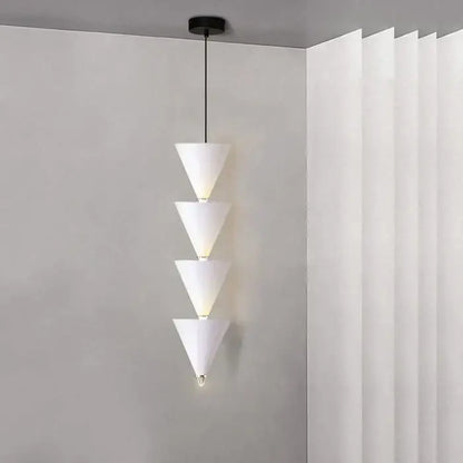 Minimalist black conical pendant light with four cream illuminated segments for decorbites cream bedroom chandelier