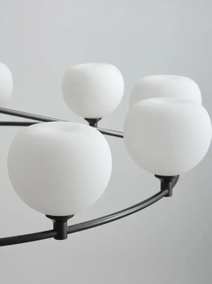 Minimalist black decorbites copper glass chandelier with frosted white spherical shades for dining room lighting