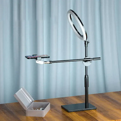 Minimalist black finish led ring light stand with adjustable phone holder and silver circular led for bedroom vanity use