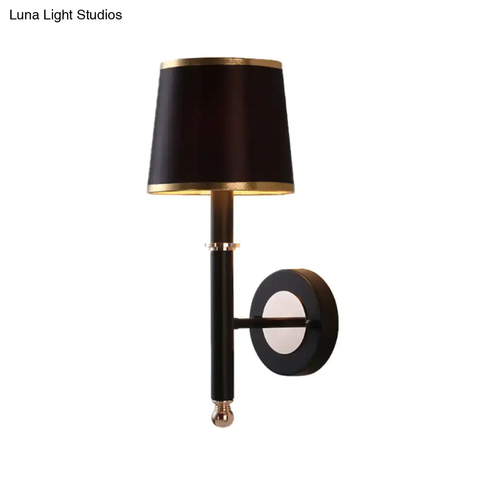 Elegant minimalist black flaxen sconce light with gold-trimmed lampshade and brass accents for 110v-120v 220v-240v use