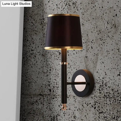 Minimalist black flaxen sconce light with black satin lampshade and gold trim on metal arm for 110v-120v 220v-240v use
