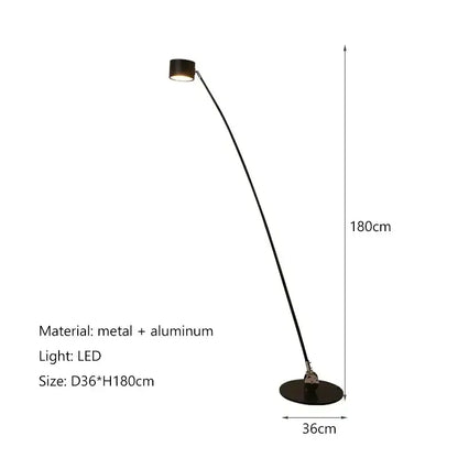 Minimalist black floor lamp with curved slender black metal and aluminum arm and circular base for living room decor