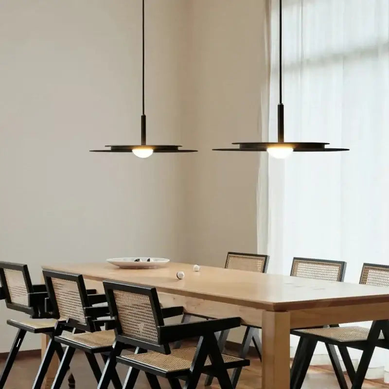Minimalist black flying saucer led chandelier kitchen pendant light with sleek disc design and warm glowing bulbs decorbites flying saucer