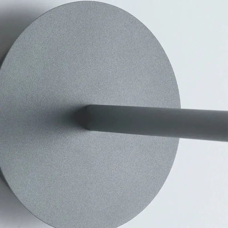 Minimalist black matte flying saucer wall lamp with gray circular base and central rod for bedroom decorbites flying saucer wall lamp