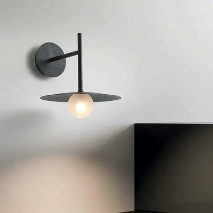 Minimalist black flying saucer wall lamp with matte finish and frosted glass bulb for bedroom decorbites flying saucer decor