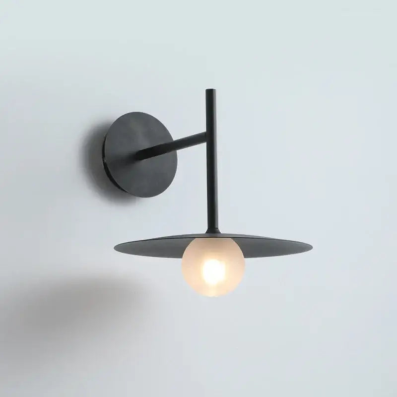 Minimalist black flying saucer wall lamp with circular base and warm bulb for bedroom decorbites flying saucer wall lamp