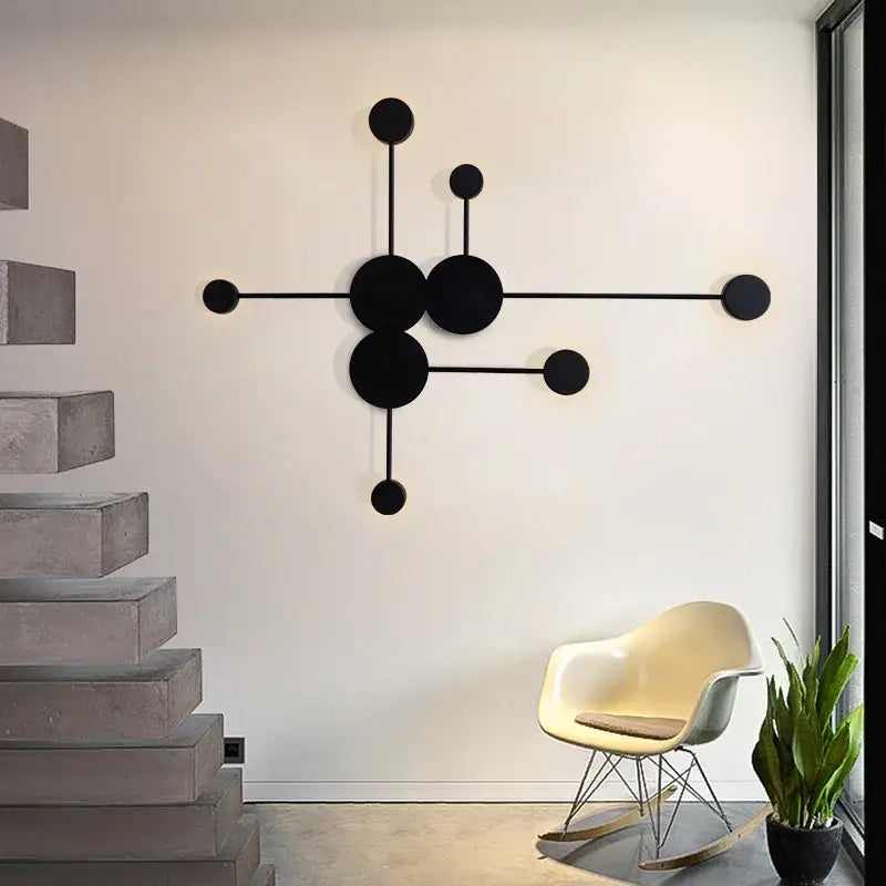 Minimalist black geometry led wall light featuring interconnected circles and rods for living room decorbites geometry led