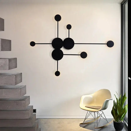 Minimalist black geometry led wall light featuring interconnected circles and rods for living room decorbites geometry led