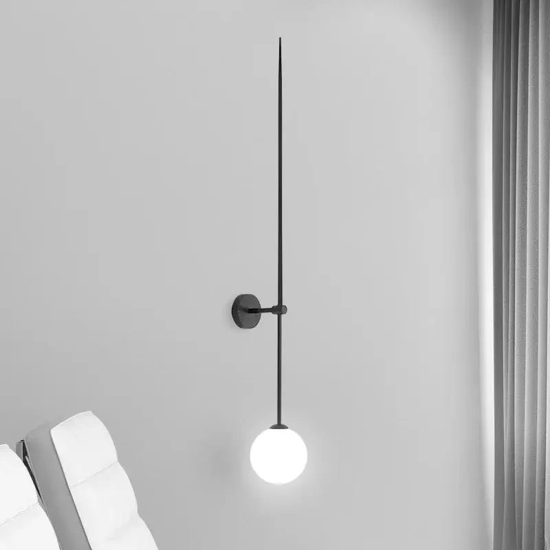 Minimalist black glass ball led wall light with slender vertical rod and frosted glass bulb for living room decorbites wall lights