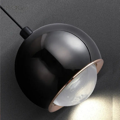 Minimalist black spherical pendant light with rose gold rim and frosted glass diffuser for decorbites gold metal luster