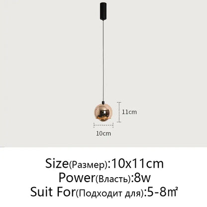 Minimalist black glossy pendant light with a sleek spherical copper-toned decorbites gold metal luster for bedroom and kitchen island