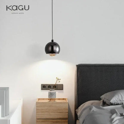 Minimalist black glossy pendant light with warm bulb and decorbites gold metal luster for bedroom and kitchen island
