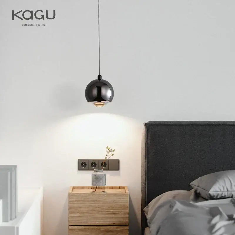 Minimalist black glossy pendant light with warm bulb and decorbites gold metal luster for bedroom and kitchen island