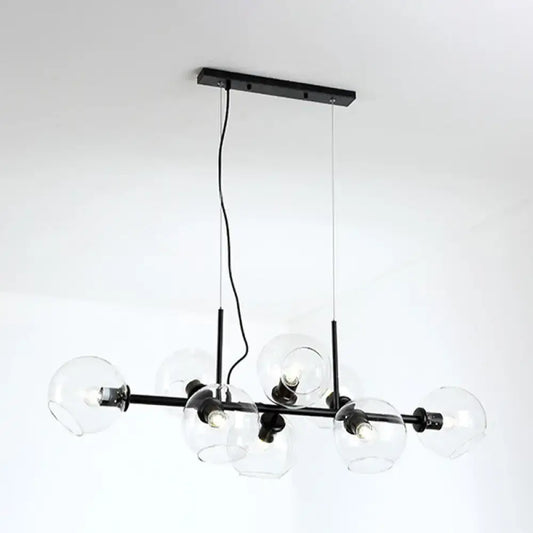Minimalist black metal chandelier with clear smoke grey glass globe shades for dining room lighting