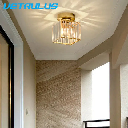 Minimalist black and gold decorbites crystal ceiling chandelier with gold-finished vertical glass prisms and square frame