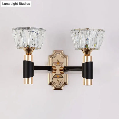 Gold-toned minimalist wall sconce with two faceted crystal shades black accents for bedroom e26 e27 bulb base lighting