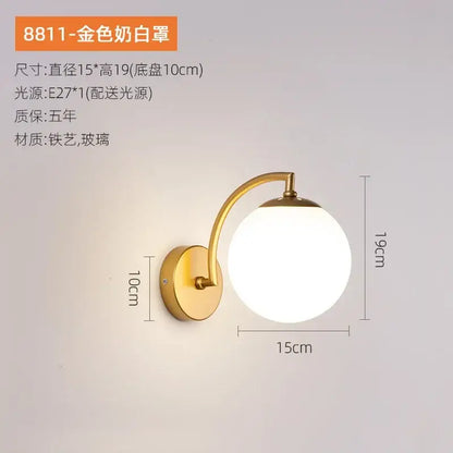 Gold-finished wall sconce with frosted white glass globe and curved metal arm in decorbites glass ball wall light style