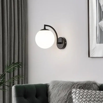 Minimalist black metal wall sconce with frosted glass globe shade decorbites glass ball wall light for bedroom decor