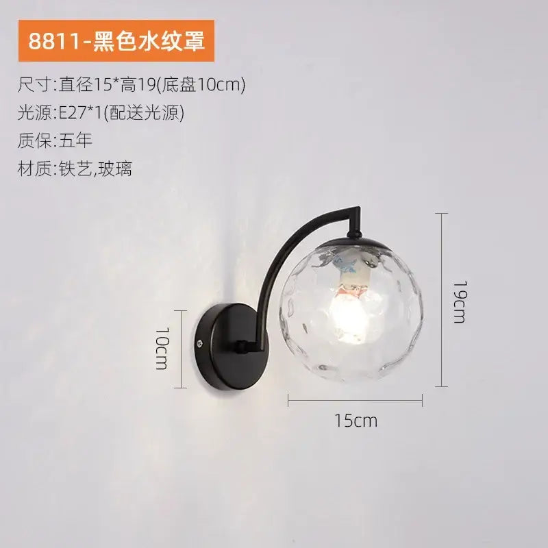 Minimalist black wrought iron and gold glass ball wall light with textured faceted globe shade for bedroom decorbites glass ball