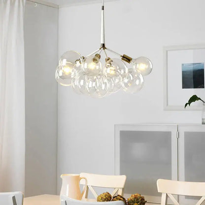 Minimalist black and gold glass balls ceiling pendant lights featuring a modern glass globe chandelier with brass accents