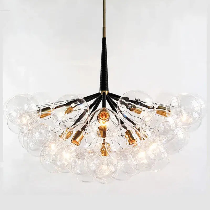 Clear glass globe pendant lights with a black stem and gold fixtures for minimalist decorbites glass balls ceiling use