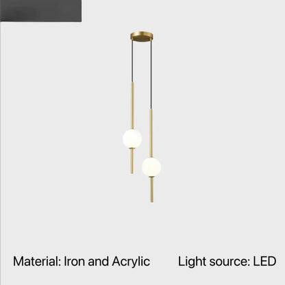 Modern brass-finished globe pendant light with two acrylic shades and slender iron rods for cord pendant installation
