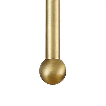 Minimalist black and gold led wall lamp featuring a sleek solid brass rod with a polished finish and smooth spherical ball end