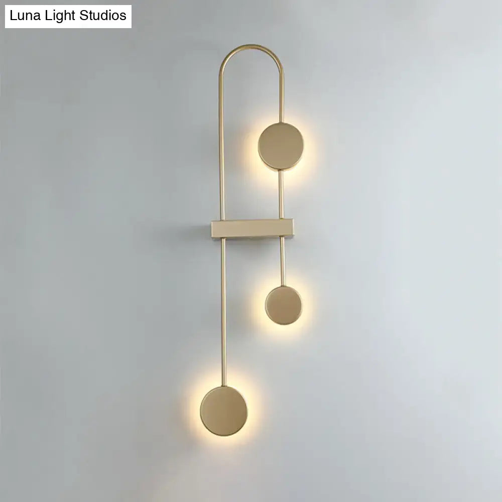 Modern minimalist black gold metal led wall sconce with three asymmetrical circular light fixtures for bedroom lighting