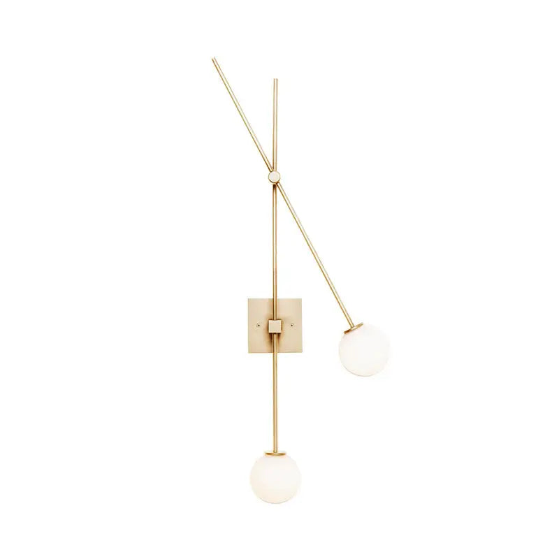 Minimalist black and gold bedroom light fixture with metal arm and opal glass bubble shades in a modern wall sconce design
