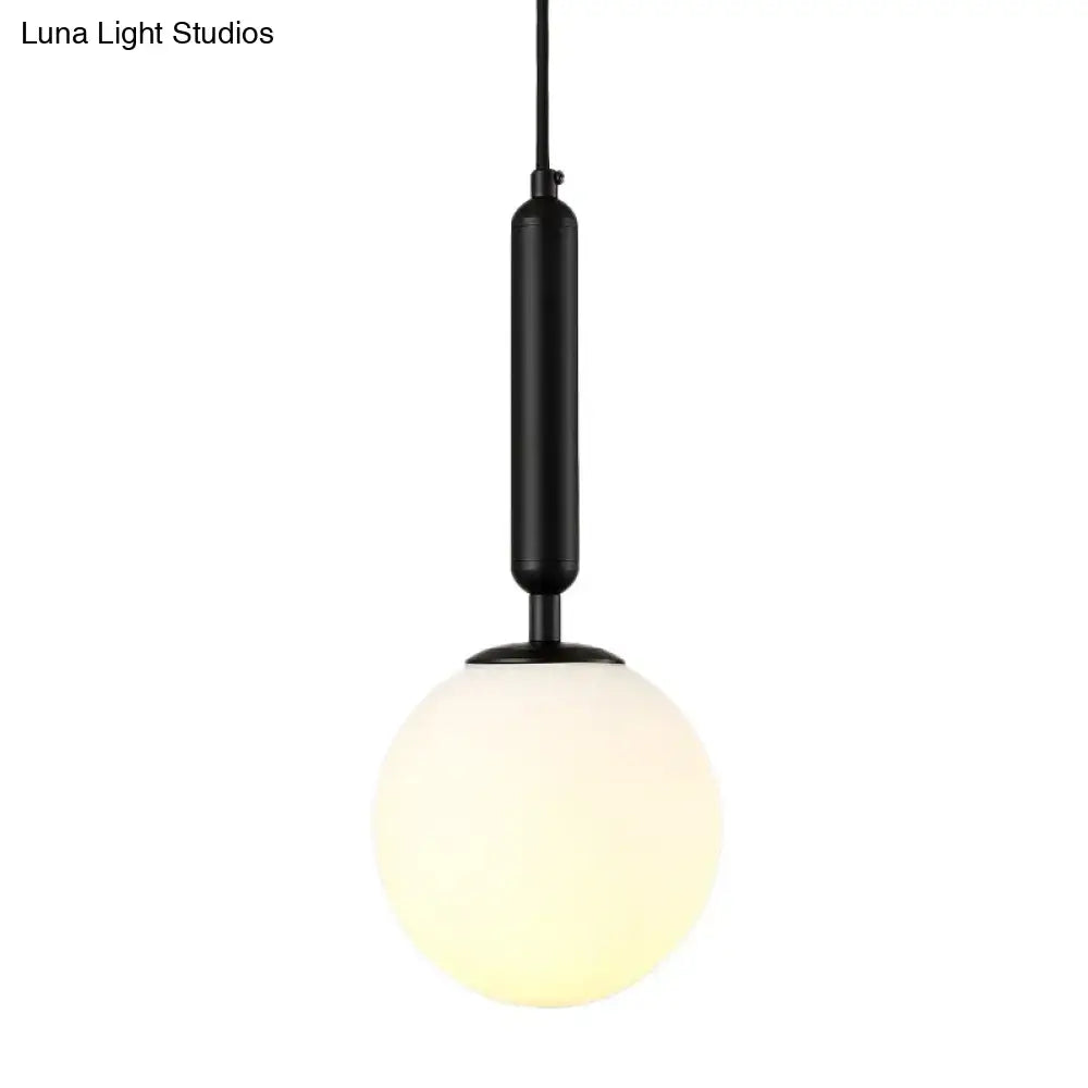 Minimalist black gold inch fixture spherical wall sconce with black cylindrical pendant and frosted glass globe