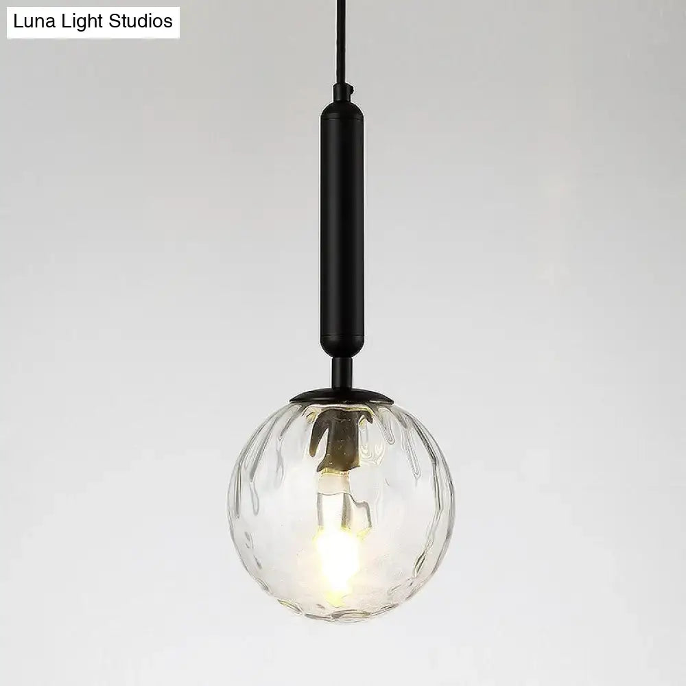 Minimalist black gold glass globe wall sconce with clear textured glass and black metal rod 8 inch fixture for bedroom lighting