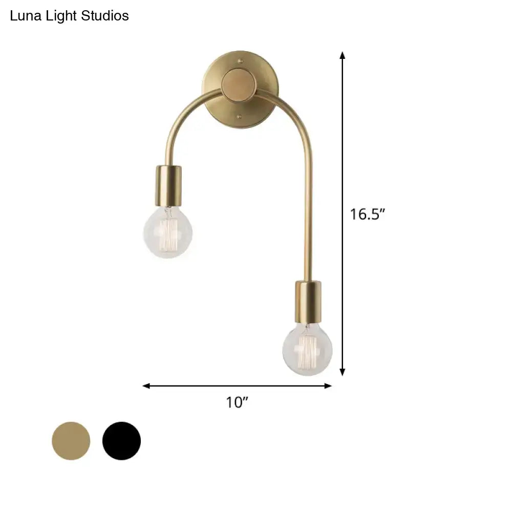 Brass-finished double-arm wall lamp with two exposed bulbs in black and gold for minimalist bedroom lighting