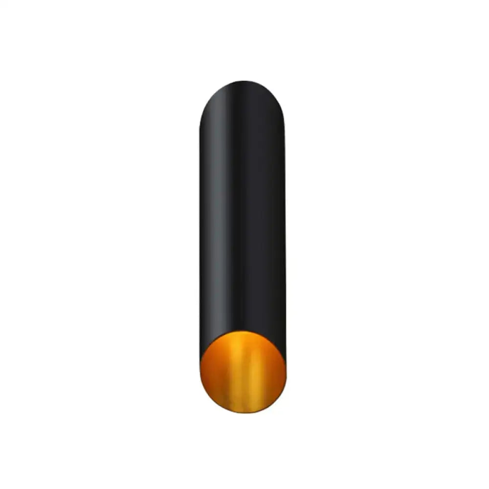 Minimalist black and gold wall light with cylindrical tube and polished base ideal as wall lamp for corridor and bedroom