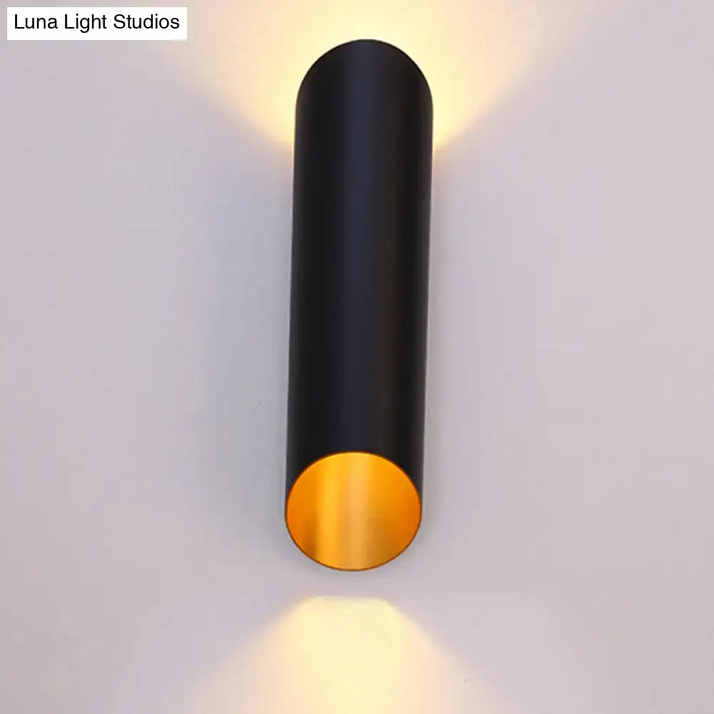 Minimalist black and gold wall light with cylindrical metal design featuring a gold interior lining for corridor and bedroom