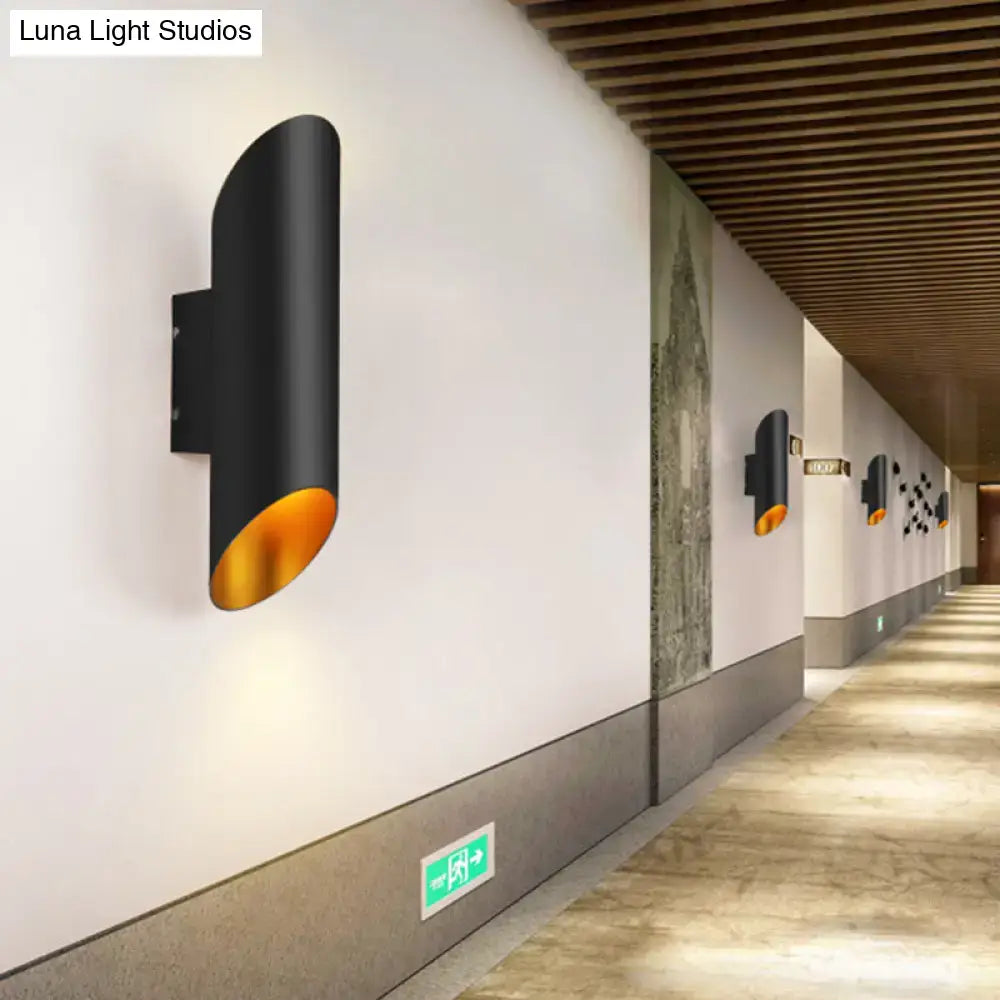 Minimalist black and gold wall light with sleek oblique tube design ideal for corridor and bedroom lighting