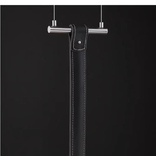 Minimalist black leather belt pendant light with white stitching and silver-toned metal bar for decorbites art minimalist decor