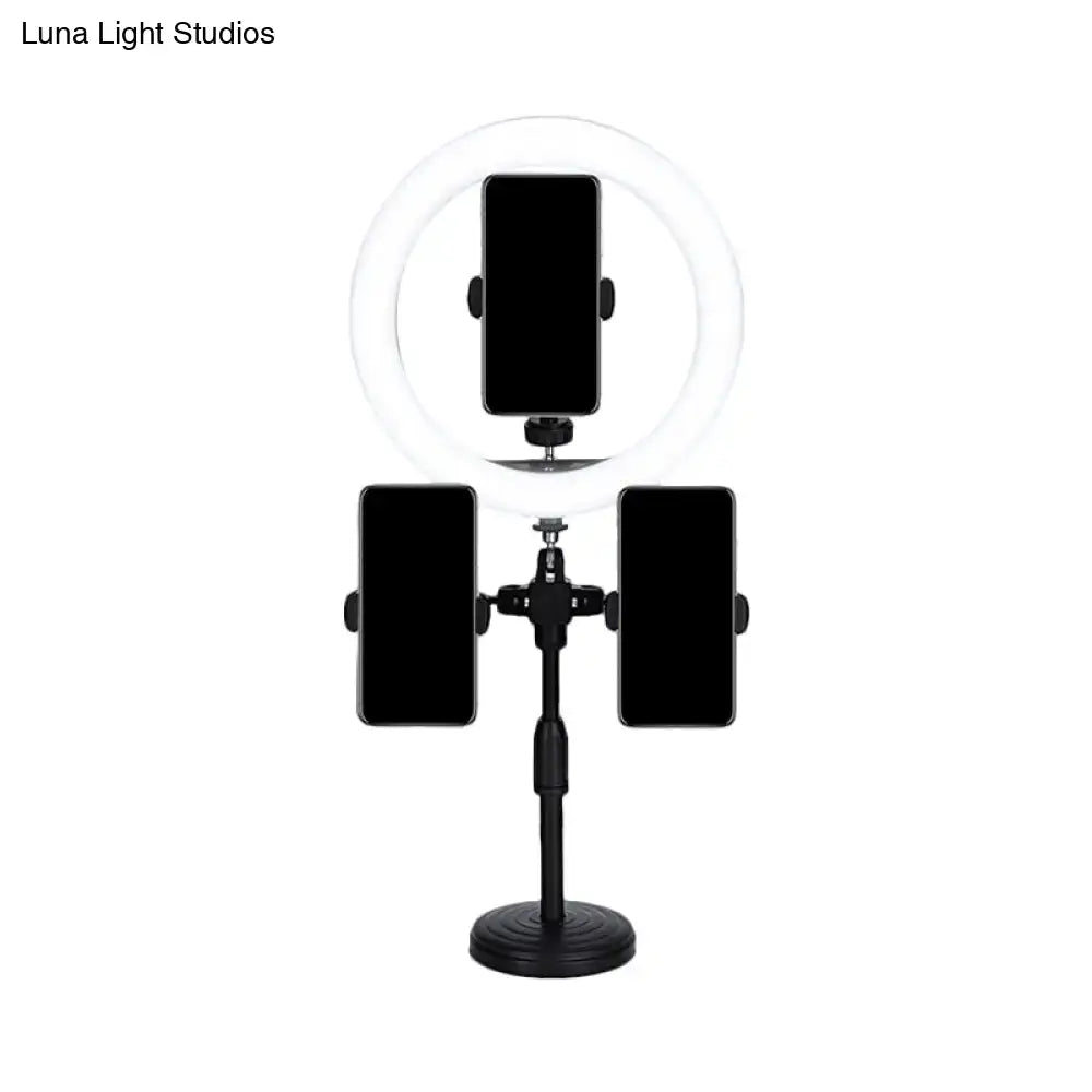 Minimalist black led mirror lamp tripod with three phone holders and circular led ring illuminator for bedroom use