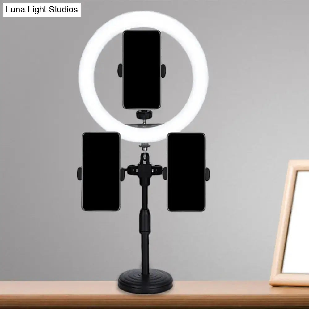 Minimalist black led mirror lamp with three phone holders on a stand for bedroom use featuring ring light design