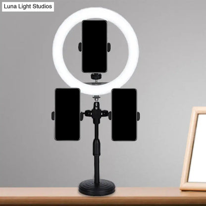 Minimalist black led mirror lamp with three phone holders on a stand for bedroom use featuring ring light design