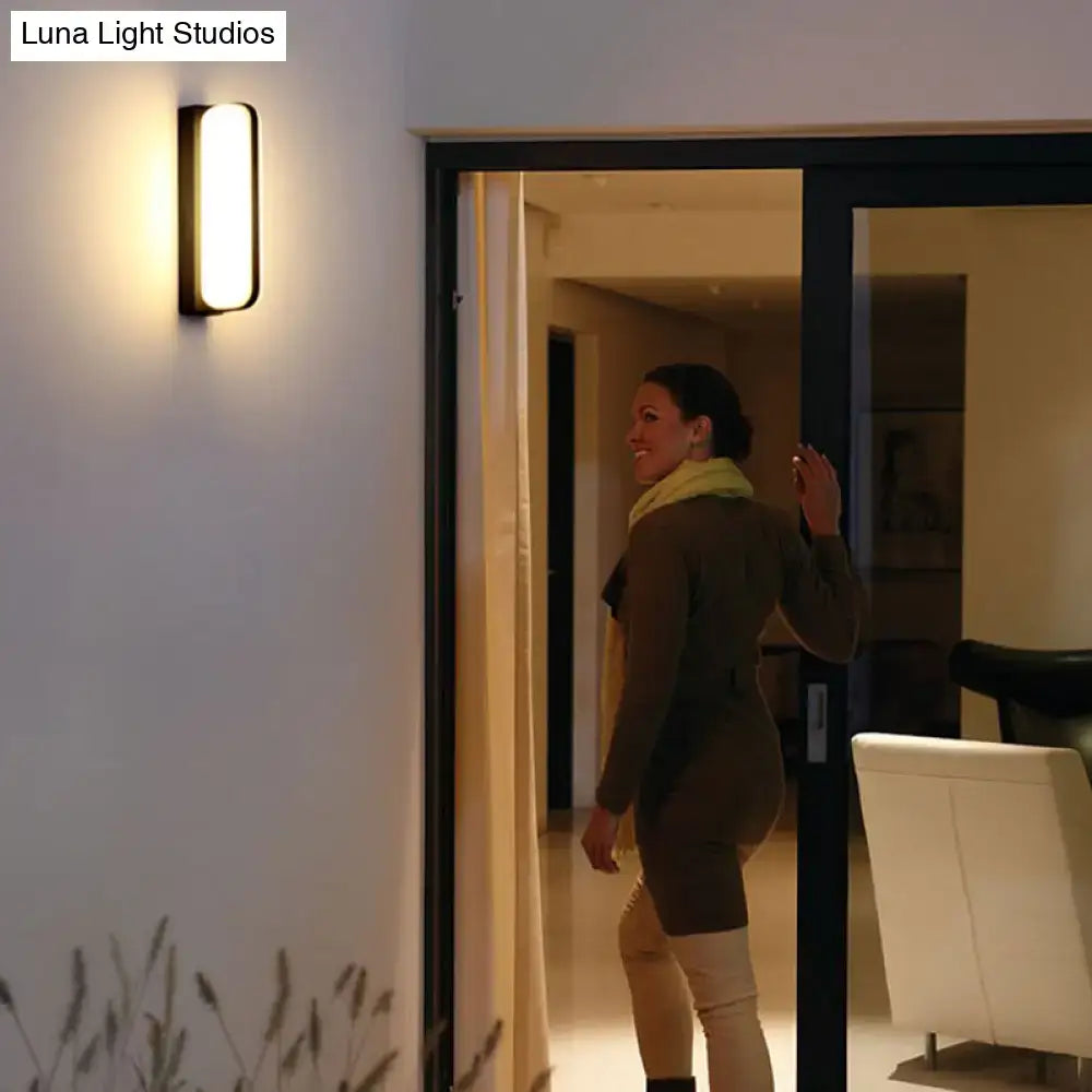 Minimalist black led wall sconce with sleek rectangular frame and warm diffused light 220v-240v inch fixture