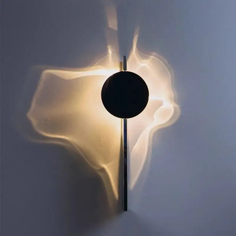 Minimalist black led wall sconce with sleek circular design and warm ambient light for living room decorbites led wall lighting