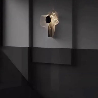 A minimalist black led wall sconce with a sculptural translucent white body and dark circular accent for living room decorbites led wall