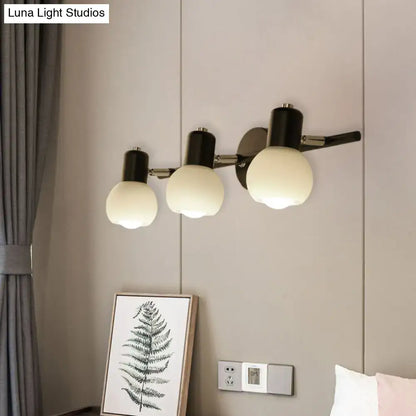 Minimalist black linear design wall lamp with opal glass and three adjustable spherical arms for study room lighting
